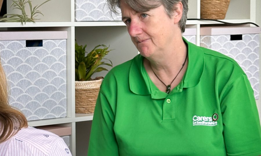 Jenny Benefits Advisor Jenny looking and listening to a Carer
